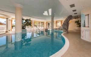 a large swimming pool in a house at Hotel Kaserhof in Valles