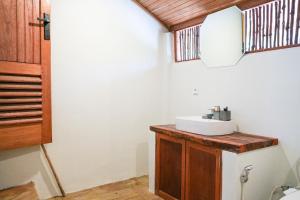 a bathroom with a sink in a room at Villa Ombak in Katiet +41 photos