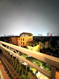 a view of a city from a balcony with buildings at Green Luxury Hotel in Hà Ðông