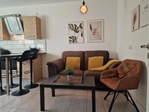 a living room with a couch and a table at Helbings Apartments Essen in Essen