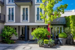 a building with plants in front of it at Hotel im Hof in Munich