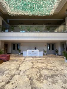 a large building with a stage in the middle at The Supreme Hotel and Banquet in Gaya