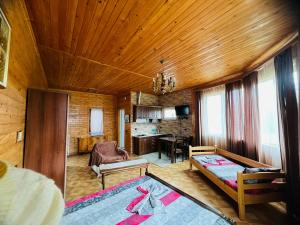 a living room with a bed and a couch and a table at Hotel Roba in Ureki