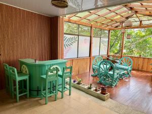 a room with chairs and a table and a wheel at Casa Boho in Quesada