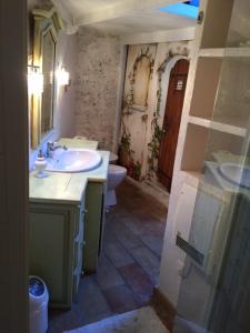 a bathroom with a sink and a toilet at Ma Maison in Vence +19 photos