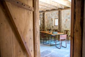 a room with a table and chairs in a building at Domaine de Malpas in Villers-le-Lac