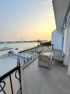 a balcony with benches and a view of the ocean at فلة درة العروس in Jeddah