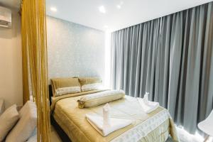 Postel nebo postele na pokoji v ubytování CA&SA Serviced Apartment