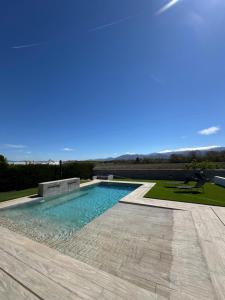 a swimming pool in the middle of a yard at Villa Baena in Granada