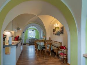 a kitchen and dining room with a table and chairs at Ferienwohnung Reichel in Remptendorf +9 photos