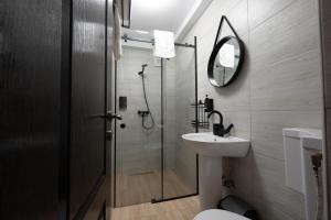 a bathroom with a shower and a sink and a toilet at 3 Baneasa Airport in Bucharest +35 photos