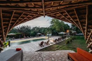 a view of a pool at a resort at Hostal La Media Luna Palomino in Palomino