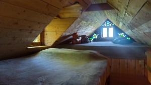 a bedroom with a bed in a small room at Cabane perchée in Mongauzy +11 photos