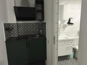 a bathroom with a sink and a counter top at Family Нotel Banuri in Kutaisi +47 photos