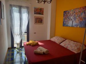 a bedroom with a bed with two towels on it at Sole in Quartu Sant'Elena