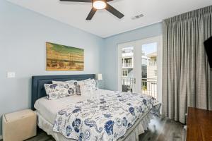 a bedroom with a bed and a ceiling fan at 477 Fort Pickens Rd. in Pensacola Beach