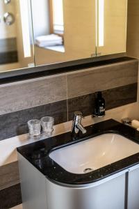 a bathroom with a sink and a mirror at Haus Lara - Fewo 1 in Wallgau