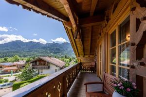 a balcony with a view of the mountains at Haus Lara - Fewo 3 in Wallgau
