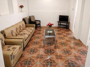 a living room with a couch and a table at BtC Apartments St Paul's in Saint Paulʼs