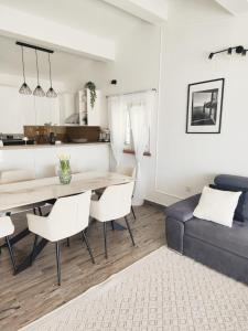 a living room with a dining room table and a couch at Antoni Apartment in Lastovo