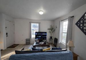 a living room with a couch and a table at Passive Stays Mountain Home 2BR in Mountain Home
