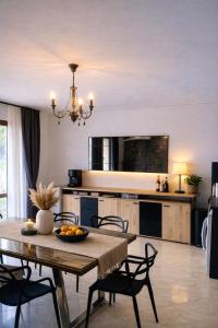 a kitchen and dining room with a table and chairs at Stefaniya Apartments in Sozopol