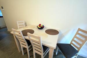 a table and chairs with a toy on top of it at Izba Kupiecka in Bystrzyca Kłodzka +5 photos
