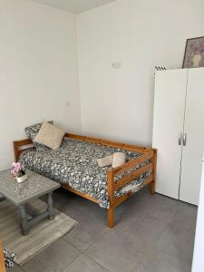 a small room with a bed and a table at studios N5 in Le Mans