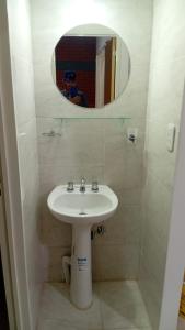 a bathroom with a sink and a mirror at Dptos Edu in Malargüe