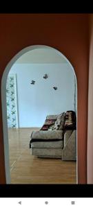 a bedroom with a bed in a mirror at Apartament Amurg in Dej +2 photos