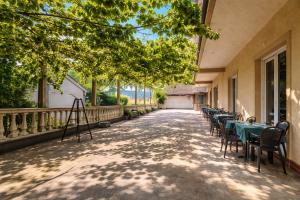 a row of tables and chairs on a patio at Apartments Zenit in Kotor