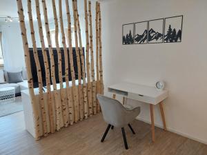 a desk and a chair in a room at Apartment in Stetten bei Mindelheim in Stetten