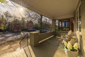 a porch with a view of a street at Walkable Designer Cottage In GV in Columbus