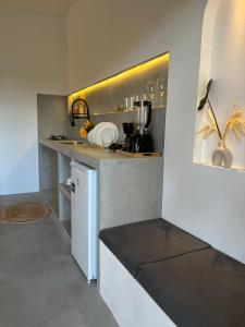 a small kitchen with a counter and a sink at Casa Ninho in Atins +23 photos