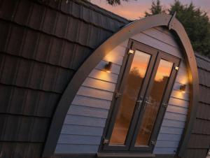an arched window on the side of a house at Avondale Lytham - Private Luxury Pod - Walk to Lytham Green in Lytham St Annes +5 photos