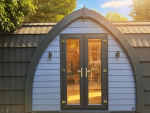 an arched window on a house with a door at Avondale Lytham - Private Luxury Pod - Walk to Lytham Green in Lytham St Annes