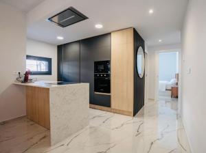 a kitchen with a counter and an oven in it at Casa Lauri in Orihuela Costa