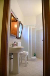 a bathroom with a sink and a shower at Porta di Mare in Sciacca