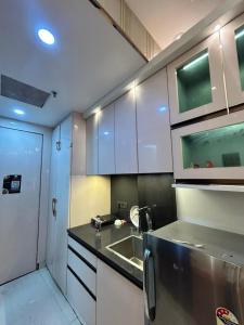 a kitchen with a sink and a counter top at THE MOONLIGHT STUDIo in Noida