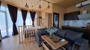 a living room with a couch and a table at Eco Elegance in Makho
