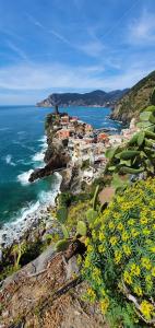 a group of houses on a cliff next to the ocean at C123 Luxury in Chiavari