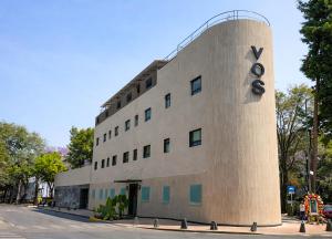 a building with a sign on the side of it at VOS Condesa in Mexico City