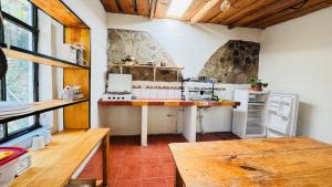 a large kitchen with a counter in a room at Luminous Haven Atitlan #1 in San Marcos La Laguna +35 photos