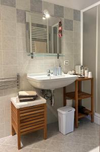 a bathroom with a sink and a mirror at B&B Il Picchio in Mergozzo