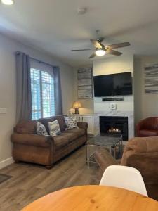 a living room with a couch and a fireplace at Tranquil Terrace in Oceano