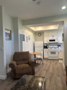 a living room with a couch and a kitchen at Tranquil Terrace in Oceano