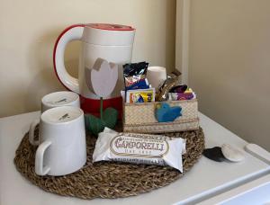 a tray with a coffee mug and other items on a counter at B&B Il Picchio in Mergozzo +52 photos