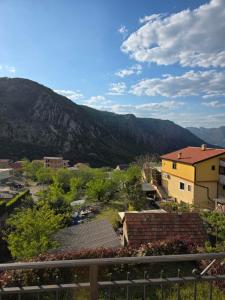 a view of a town with mountains in the background at Apartment Perović in Kotor
