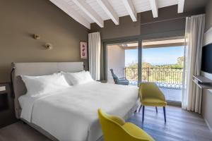 a bedroom with a bed and a balcony at Suni Rural Relax in Suni +40 photos