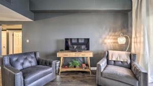 a living room with two leather chairs and a tv at 3 Mi to Skiing Mtn-View Condo in Sugar Top Resort in Sugar Mountain